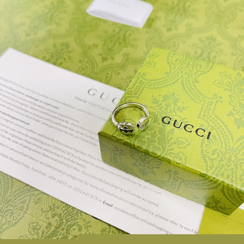 G*u*i earrings